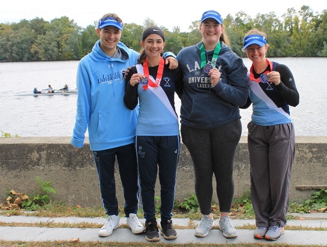 A group of people posing for a photo Description automatically generated with medium confidence